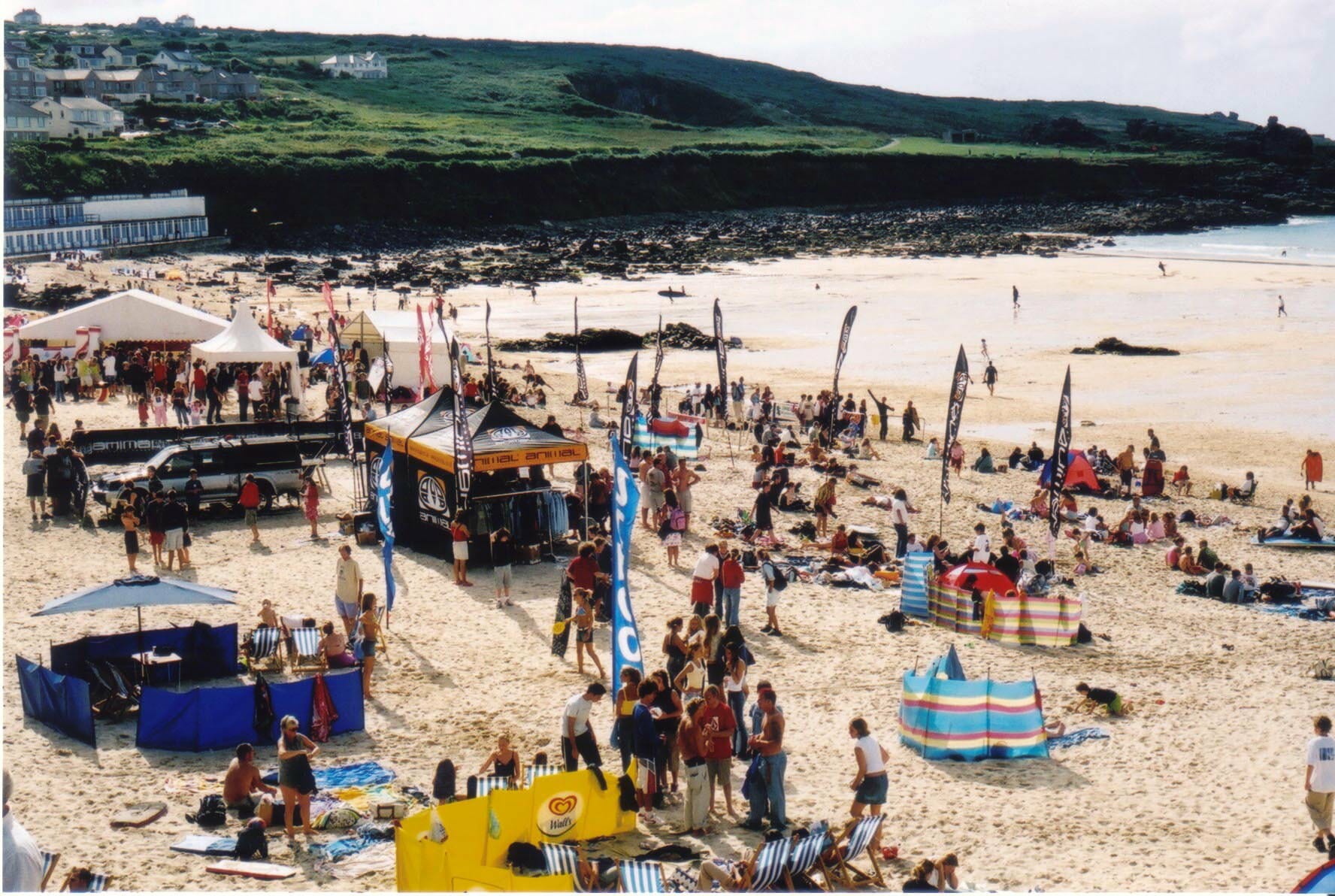 St Ives in surfing season, can you spot the man in the red and white stripey top?